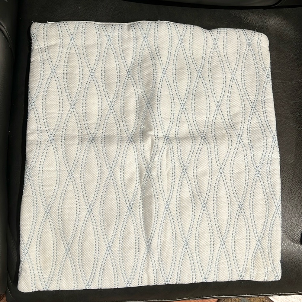 Two decorative pillow covers.  White with blue accents